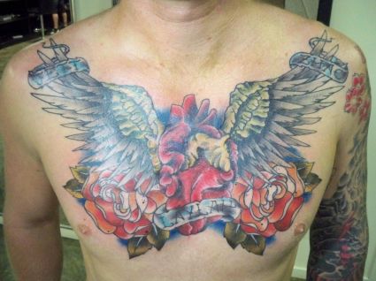 Heart And Wing Chest Tattoo